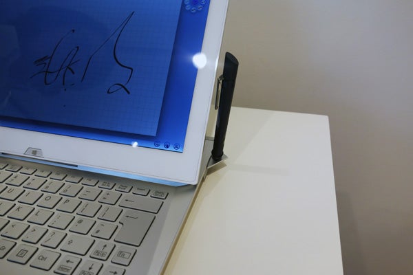 Sony Vaio Duo 13 hybrid laptop in pen input mode on desk.