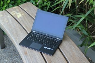 Lenovo IdeaPad Yoga 11S laptop on an outdoor bench.