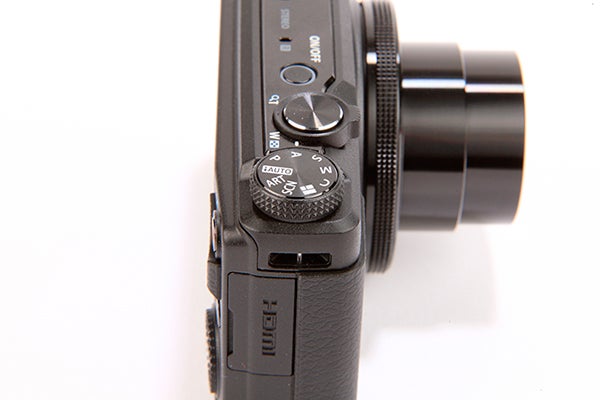 Close-up of Olympus XZ-10 camera's controls and lens.