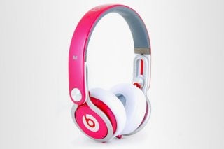 Pink and white Beats by Dr. Dre Mixr headphones.