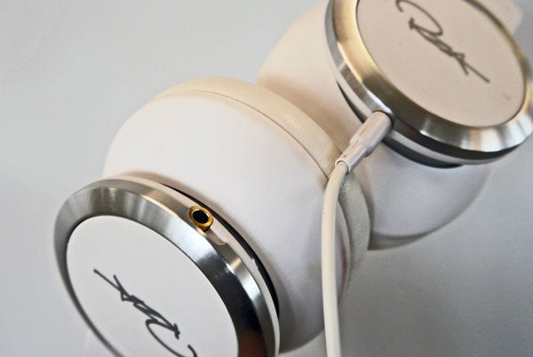 Close-up of WeSC Chambers by RZA headphones with signature.