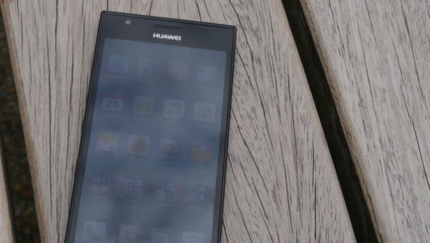 Huawei Ascend P2 smartphone lying on wooden planks