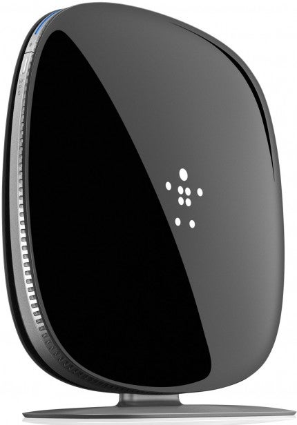 Modern black wireless speaker side view on white background.