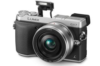 Panasonic Lumix GX7 camera with lens and pop-up flash.
