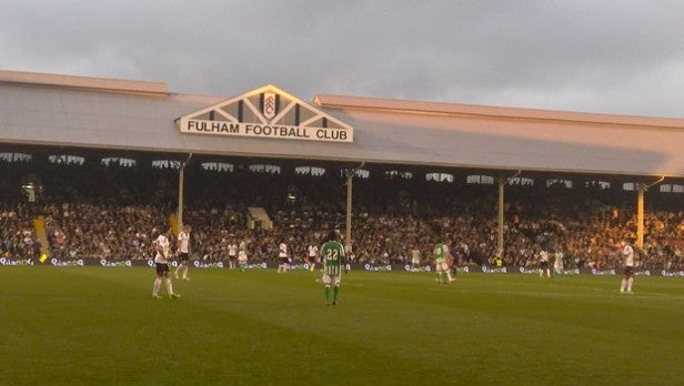 Soccer match in progress at Fulham Football Club stadium.