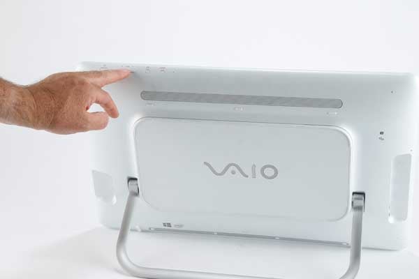 Person pointing to Sony Vaio Tap 20 computer's rear ports.