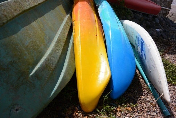 Kayaks leaning together showcasing vibrant color detail.