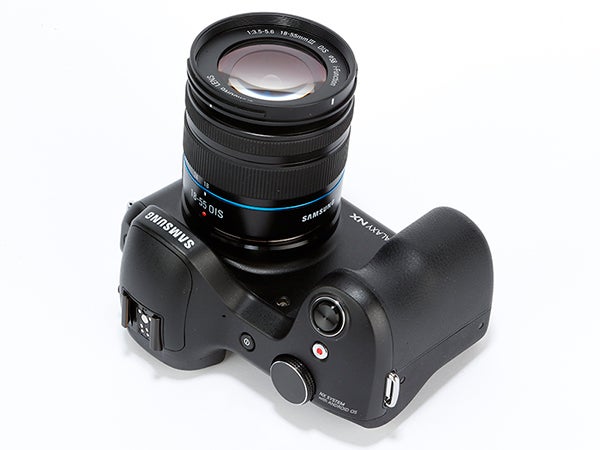 Samsung Galaxy NX camera with lens on white background.