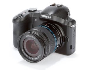 Samsung Galaxy NX camera with lens on white background.