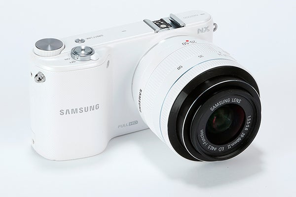 Samsung NX2000 camera with lens on white background.