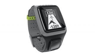 TomTom Runner GPS watch displaying distance and elevation data.