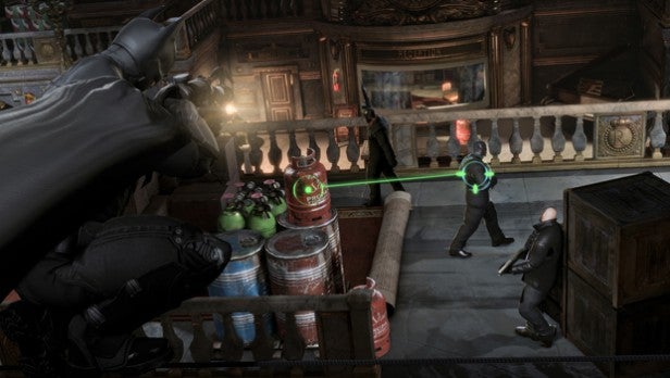Screenshot of Batman: Arkham Origins gameplay with combat scene.