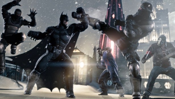 Batman in combat with multiple assailants in a snowy cityscape.