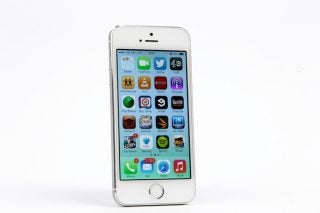 iPhone 5S with displayed apps on white background
