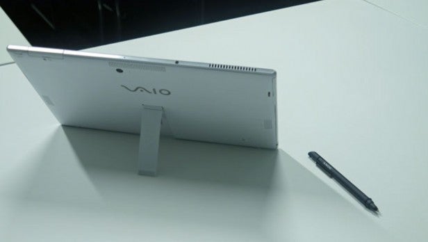 Sony Vaio Tap 11 tablet with stylus on white surface.Sony Vaio Tap 11 tablet with stylus on a table.