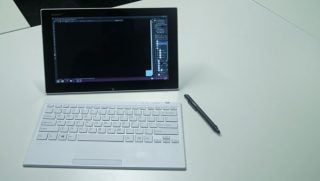 Sony Vaio Tap 11 tablet with keyboard and stylus on desk.