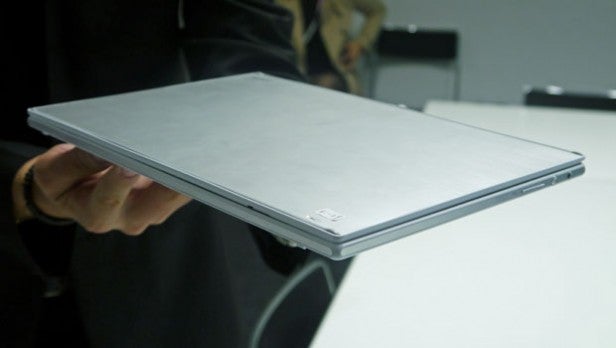 Person holding a Sony Vaio Tap 11 tablet computer.Person holding a closed Sony Vaio Tap 11 tablet PC.