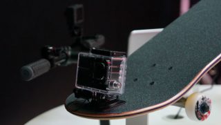Toshiba Camileo X-Sports camera mounted on a skateboard.