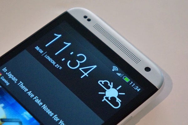 HTC Desire 601 smartphone displaying time and notifications.
