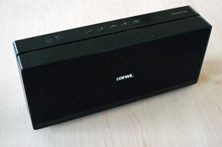 Loewe Speaker 2go portable Bluetooth speaker on table.