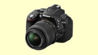 Nikon D5300 DSLR camera with lens on a neutral background.