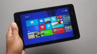 Hand holding Dell Venue Pro 8 showing start screen.