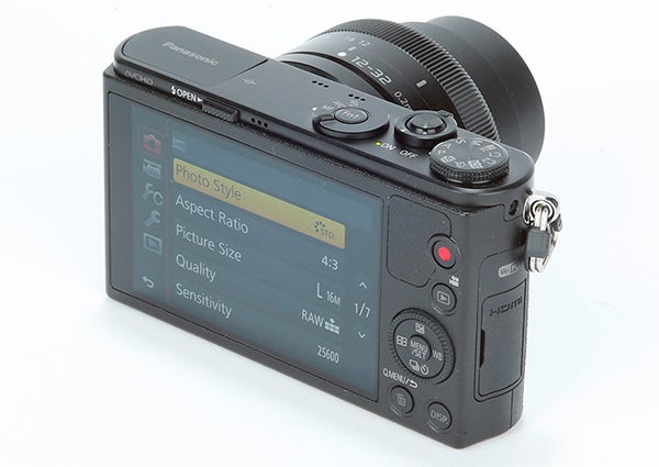 Panasonic Lumix DMC-GM1 camera with settings display screen.