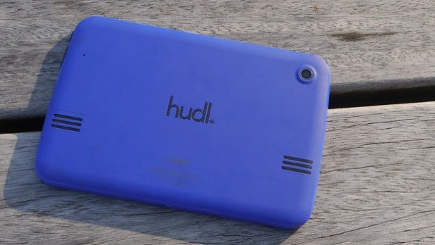 Blue Hudl tablet with rear camera on wooden surface.