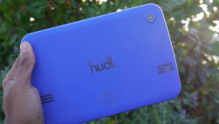 Hand holding a blue Tesco Hudl tablet from the back.