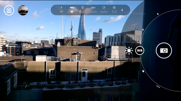 Camera app interface with cityscape view and exposure settings.