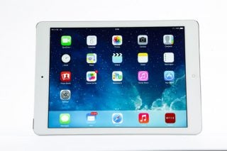 White iPad Air displaying home screen with apps