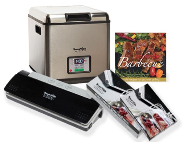 SousVide Supreme appliance with vacuum sealer and cookbook.