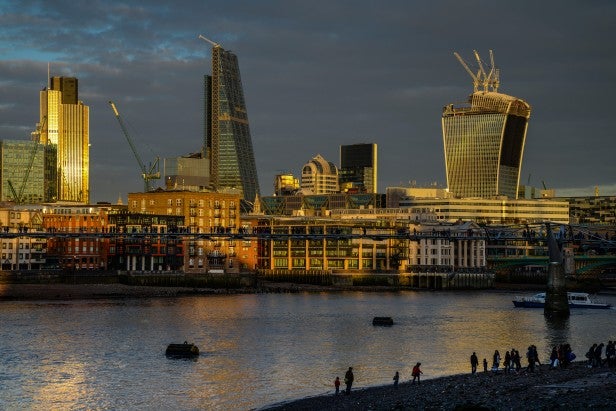 High-resolution image of London skyline at sunset.
