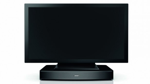 Black flat-screen television on a stand with blank screen.