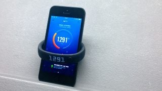 Nike Fuelband SE on wrist with connected mobile app displaying stats