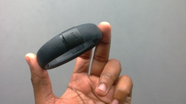 Hand holding Nike Fuelband SE activity tracker.