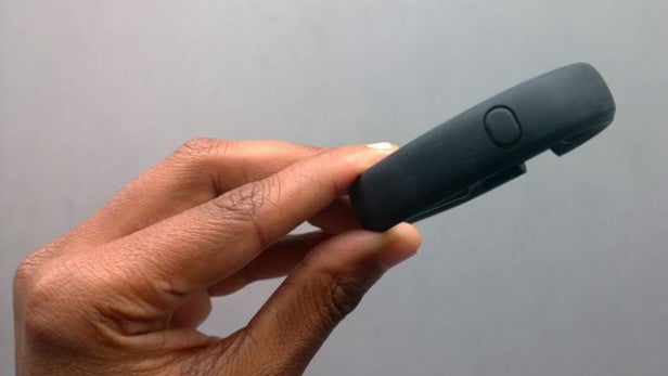 Hand holding a black Nike Fuelband SE fitness tracker