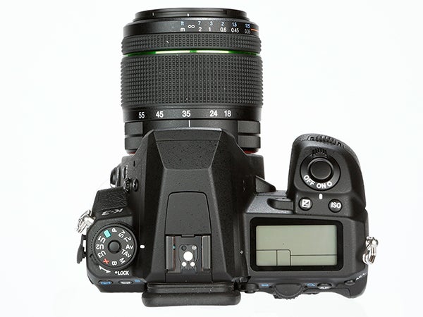 Pentax K-3 DSLR camera with lens on a white background.