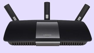 Linksys EA6900 AC1900 wireless router on purple background.
