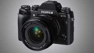Fujifilm X-T1 camera with Fujinon lens on a gradient background