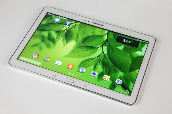 Samsung Galaxy Tab Pro 10.1 on table displaying homescreen.