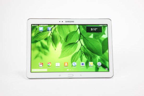 Samsung Galaxy Tab Pro 10.1 on white background displaying home screen.