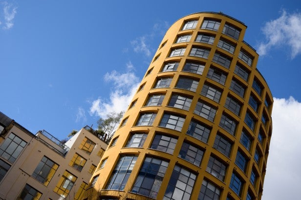 Nikon D3300High-resolution image of modern buildings against a clear blue sky.