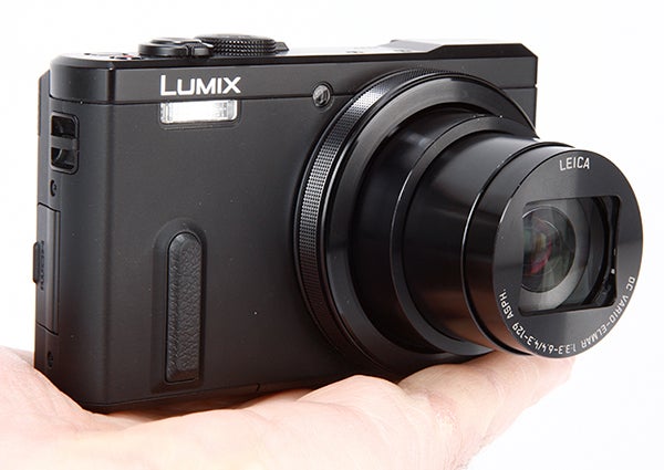 Panasonic Lumix TZ60 camera held in a person's hand.