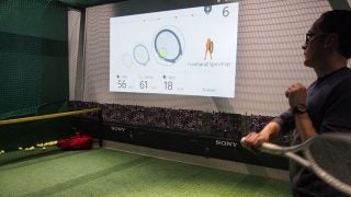 Man playing tennis with Sony sensor performance data on screen.