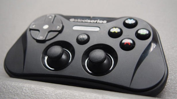SteelSeries Stratus game controller on textured surface.
