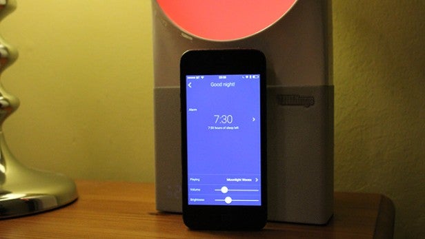 Withings Aura sleep system with smartphone app on bedside table