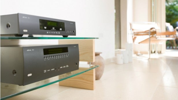 Arcam AVR450Audio equipment on living room shelf with modern design.