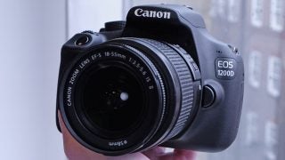 Canon EOS 1200D DSLR camera with 18-55mm lens.