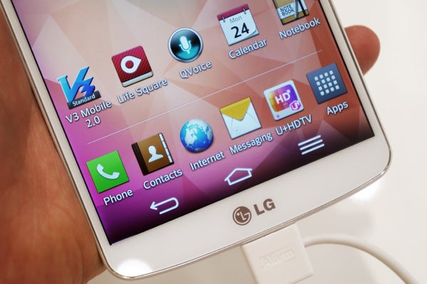 Close-up of LG G Pro 2 smartphone displaying apps on screen.